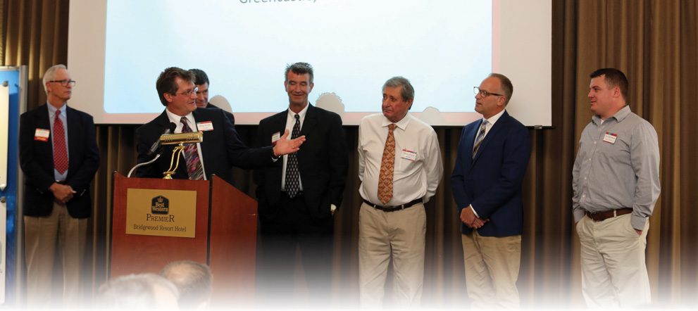 The Water-Right executive team presents a 2016 Top Gun Award to Trent Stumbaugh, Negley’s Clean Water Center, Greencastle, PA. 