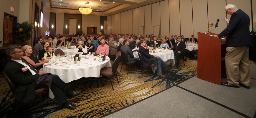 Long-time Clear Choice Water Group Director of Dealer Development R.J. Burke addresses a crowd of more than 100 water treatment professionals.
